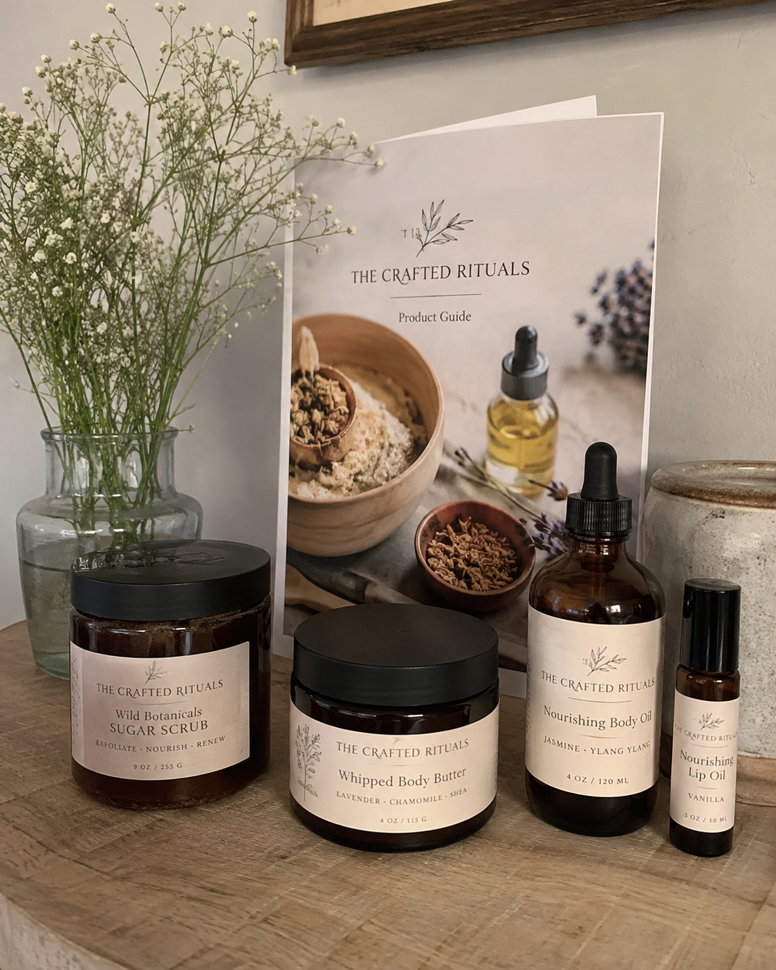 The Crafted Rituals product guide and handmade body care lineup in a home setting